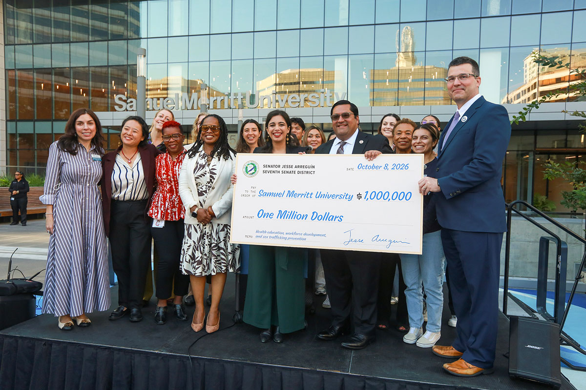 Senator Arreguín presents a check to support the creation of a new program to combat human trafficking