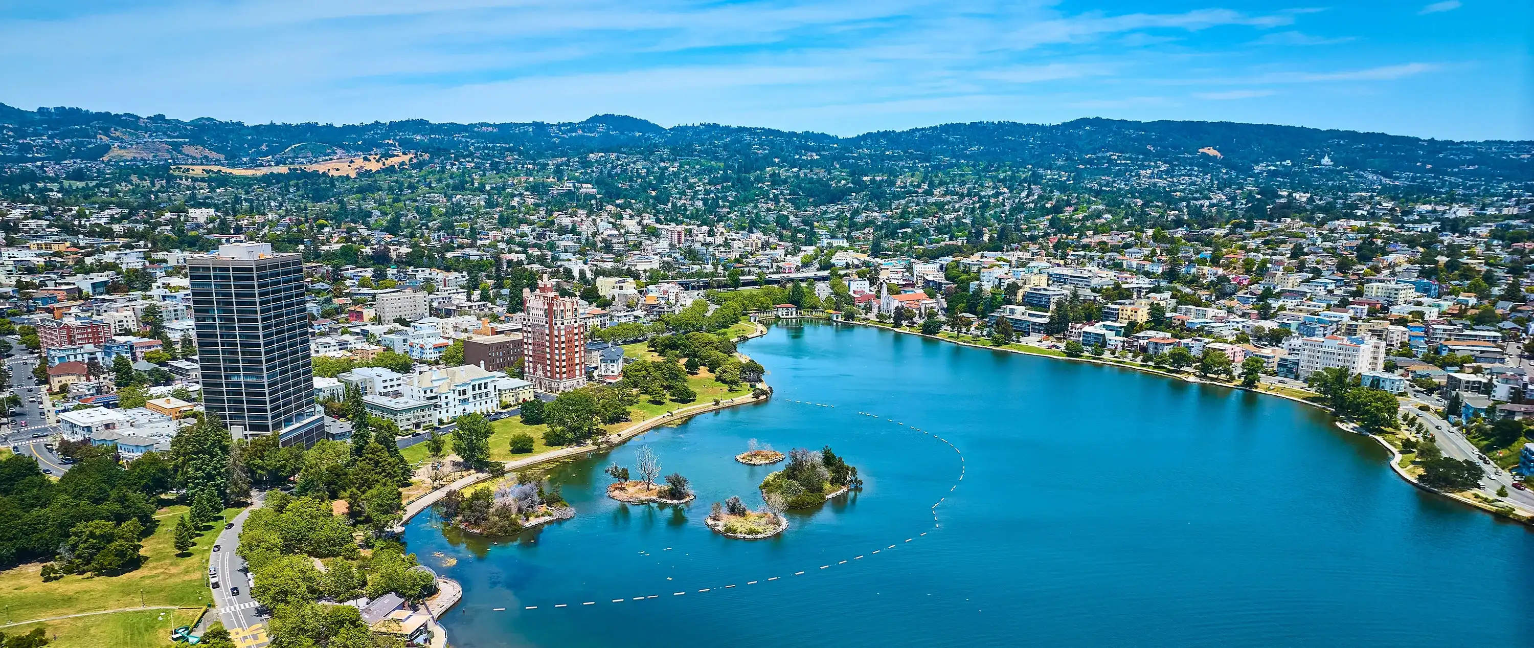 Landscape photo of Lake Merrit and the surrounding neighborhood