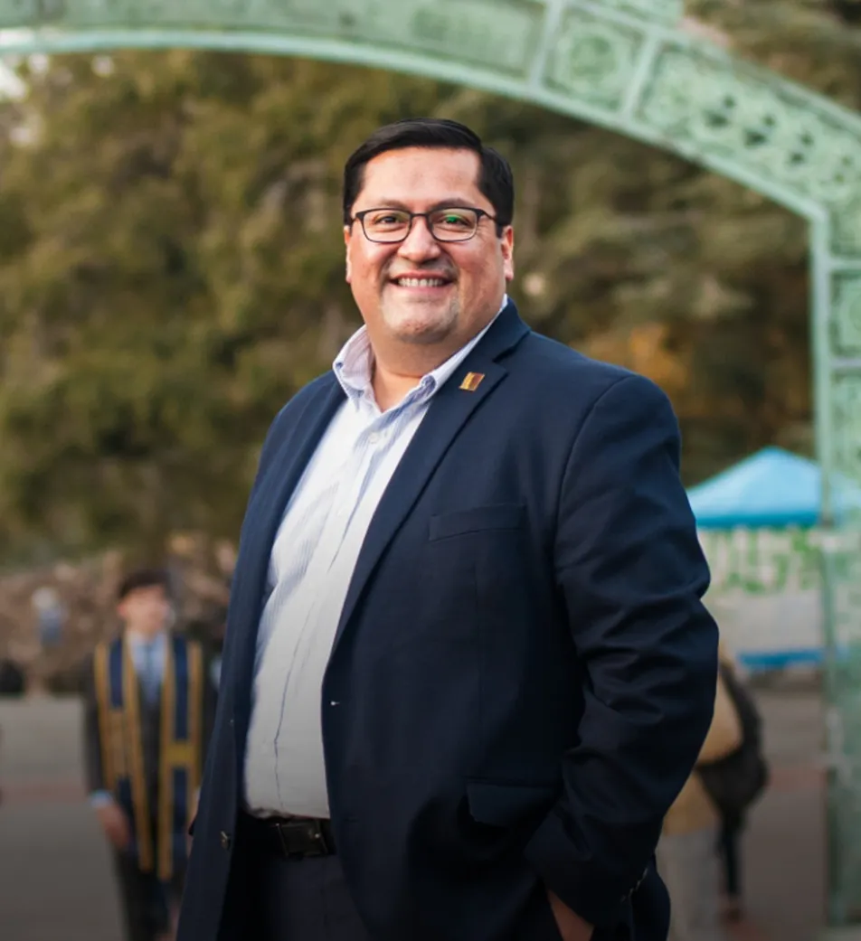 Senator Arreguín standing near the arch at U.C. Berkeley
